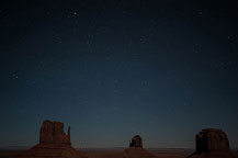 ￼ Monument Valley Under the Stars Still no LakeshoreImages website so I may start adding more photos here.  I did get up to the Monument Valley Overlook/Parking Lot a little after dusk.  I took a series of photos, most at ISO 1600, f:2.8 & 8 to 15 seconds.  There was enough moonlight to show the formations, yet allowed enough of the stars to show to make it interesting.  It would have been better if there was a power blackout - the parking lot has lots of lights.  There are a few images with lights from returning cars, and airplanes, but overall it worked OK.  I washed the trailer & RAV4 on the way out of Gouldings Camp Park.  The water spray didn't remove everything; the bugs need an actual scrubbing, but at least the first layer of red dust is gone.  It was a short drive to Blanding, UT & the Blue Mountain RV Park.  I'm in site 8, a shaded back in that just fits the trailer & RAV4. After setting up I plan to drive out to the location for the trail to House on Fire.  It is too late in the day to properly photograph it - I'll do that tomorrow.  I did drive out to the trail head, and also stopped at the "Official" Mule Canyon Ruin Exhibit, about 1/2 mile west of Arch Canyon road, the entrance to the trail head. Laurent Martres, who's 3 books "Photographing the Southwest" have been my guide to many locations feels that the exhibit was built to keep down traffic in the canyon.  I'll have to agree with him - it is far to new looking to be realistic.  ￼ Mule Canyon Ruin Exhibit   ￼ Mule Canyon Ruin Exhibit After that it was back to the campground by way of the local grocery store & some barbecued chicken for dinner.  Until Tomorrow - Monument Valley